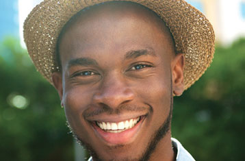 Man With Hat Smiling