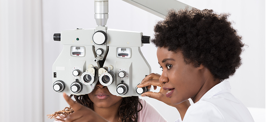 Woman Performing an Eye Exam