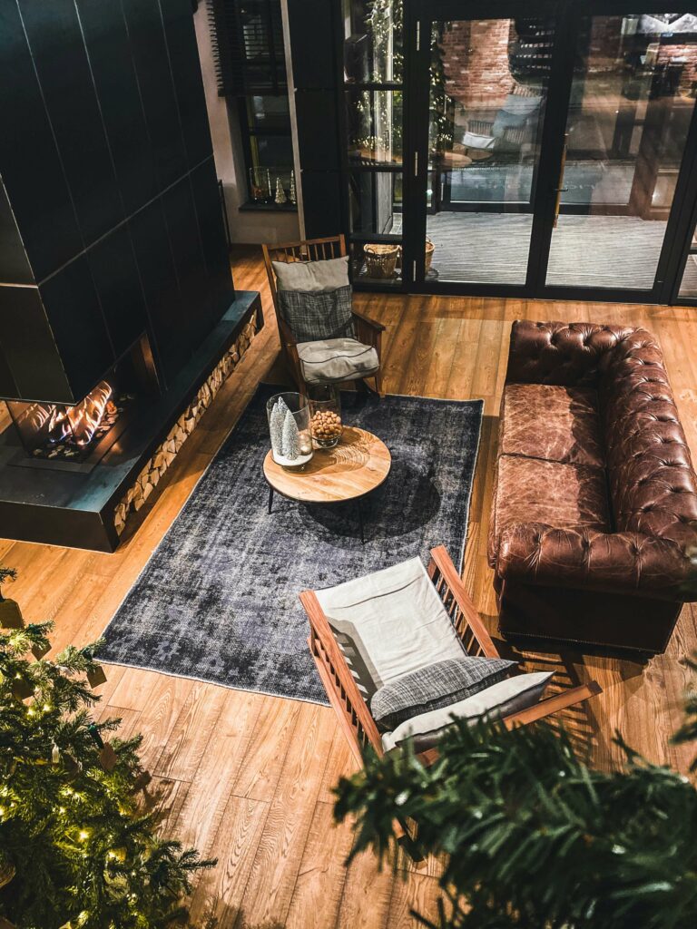 a cozy living area by a fireplace at The Nordik Spa in Chelsea, Quebec